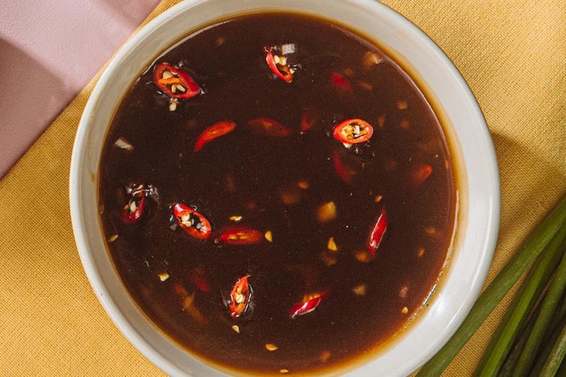 Fishball sauce in a white serving bowl. Fishball sauce in a white serving bowl.