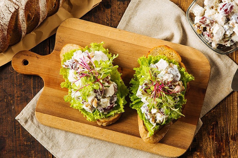 Chicken with walnut and grapes spread on toast. Chicken with walnut and grapes spread on toast.
