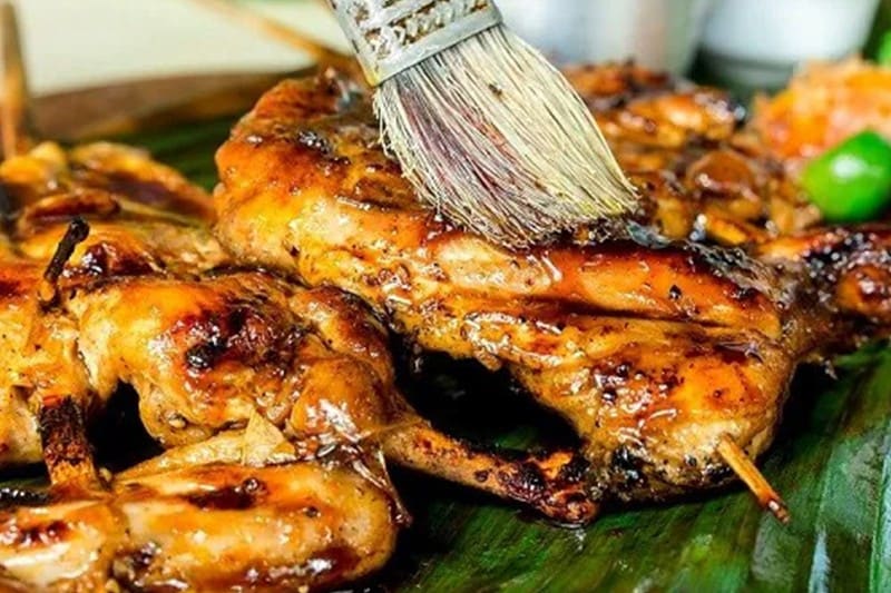Grilled chicken inasal on a banana leaf. Grilled chicken inasal on a banana leaf.