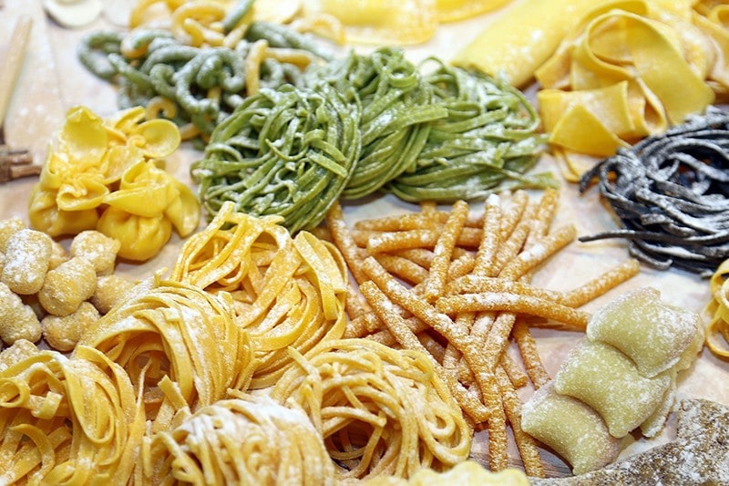 Assorted fresh pasta on a table. Assorted fresh pasta on a table.