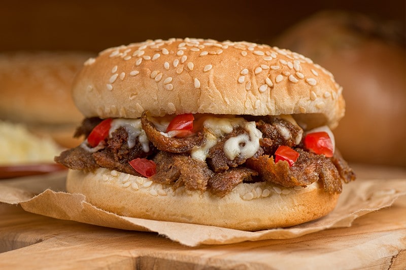 Shawarma meat with vegetables in a burger bun. Shawarma meat with vegetables in a burger bun.