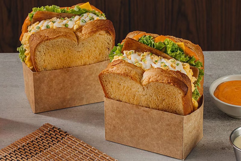 Korean egg drop sandwiches in craft boxes. Korean egg drop sandwiches in craft boxes.
