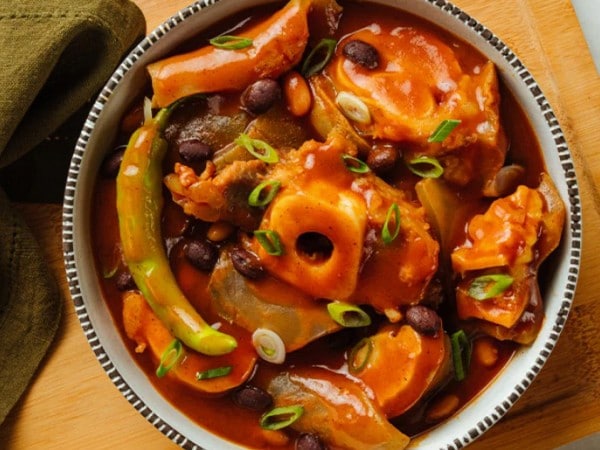 Balbacua featuring beef in a tomato-based sauce