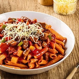 Beef kaldereta pasta made with penne and topped with cheese. Beef kaldereta pasta made with penne and topped with cheese.