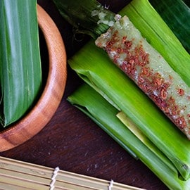 Suman pinipig with latik wrapped in banana leaves. Suman pinipig with latik wrapped in banana leaves.