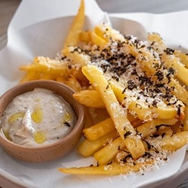 Truffle fries with cheese and a creamy mayo dip. Truffle fries with cheese and a creamy mayo dip.