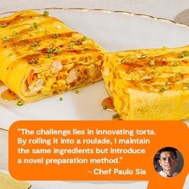 Tortang gulay egg roll on a white plate with dipping sauce.