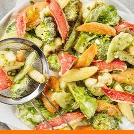 Chop suey tempura on a paper-lined plate.