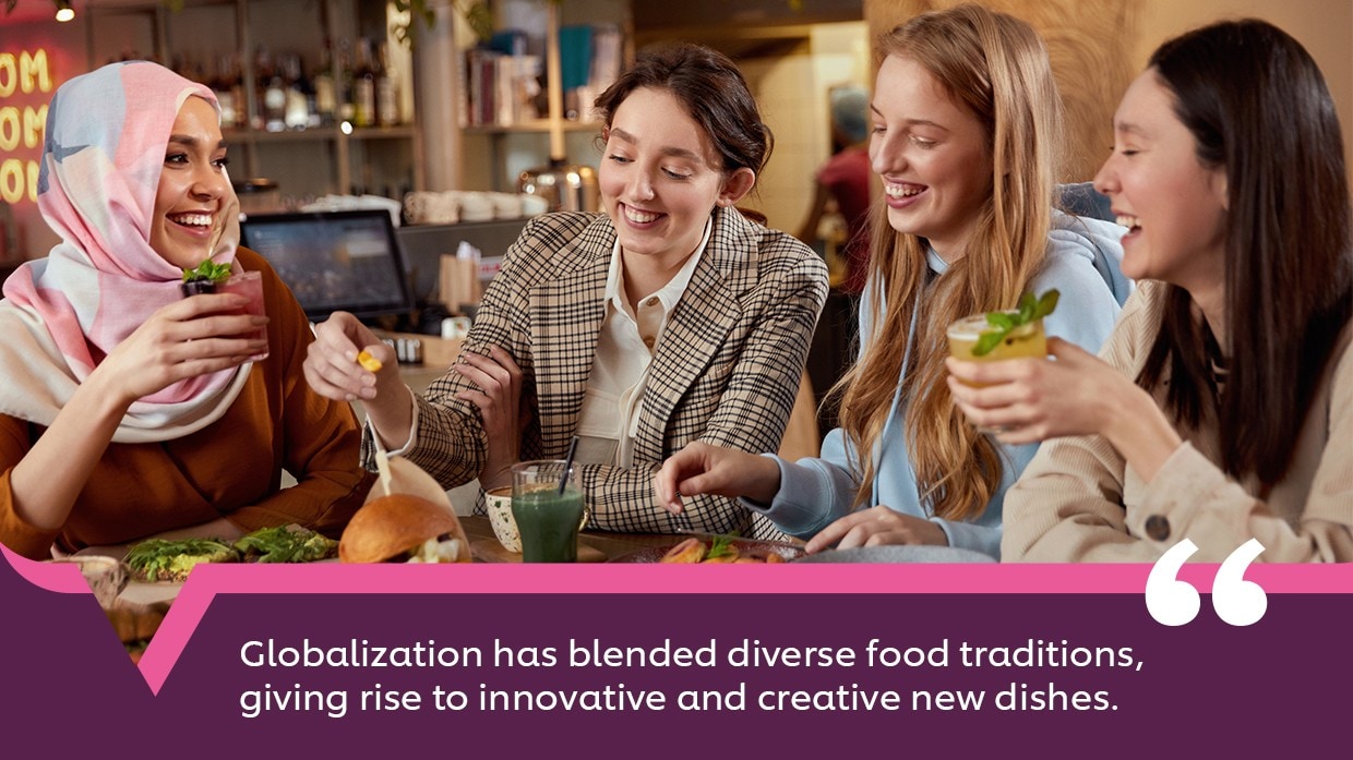 Four women of diverse ethnicities sharing a meal together. Four women of diverse ethnicities sharing a meal together.