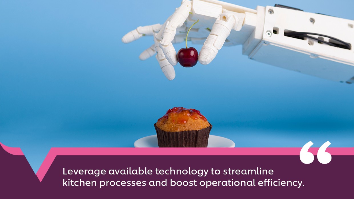 A robotic hand placing a cherry on top of a cupcake. A robotic hand placing a cherry on top of a cupcake.