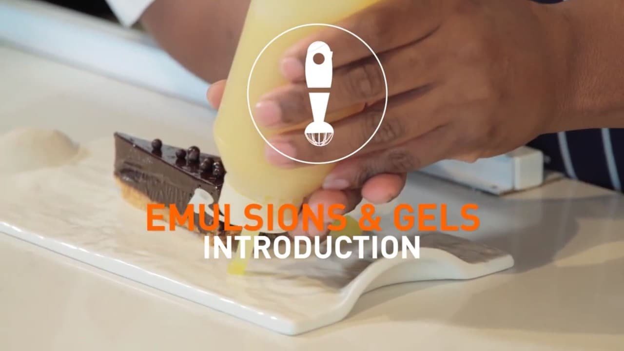 Chef with squeeze bottle with text caption  that reads: Emulsions and  Gels .Introduction