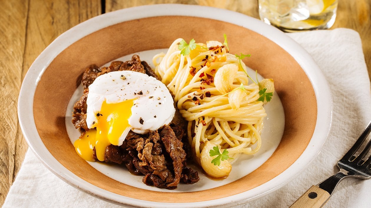 Aglio Olio Pasta with Tapa and Poached Egg