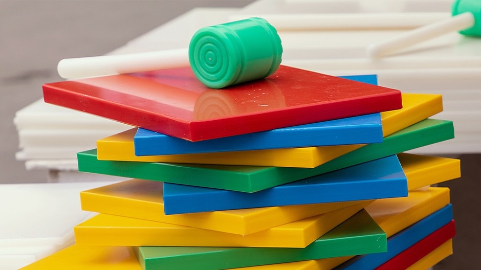 A stack of color-coded chopping boards.