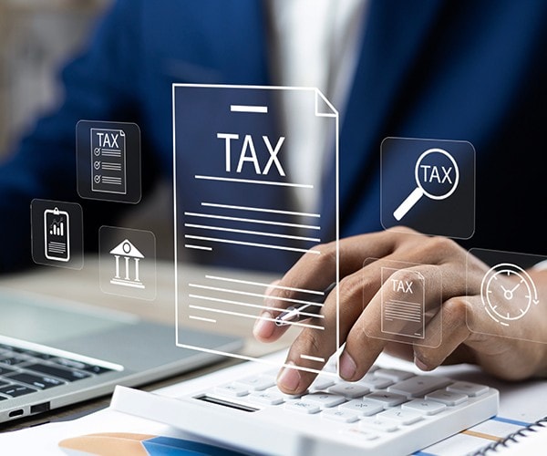 A man computing taxes. A man computing taxes.