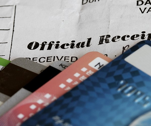 An official receipt covered by credit cards. An official receipt covered by credit cards.