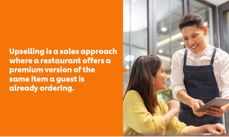 A waiter showing a customer their menu through a tablet.