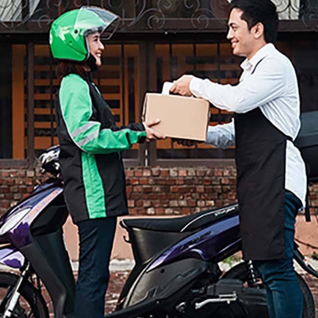 Grabfood rider getting order from restaurant Grabfood rider getting order from restaurant