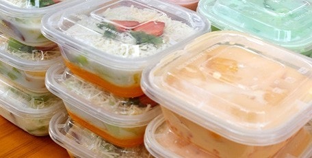 Buko pandan, mango sago, and other Filipino desserts in plastic containers.