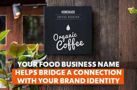Café signage with black background hanging on wood fence. Café signage with black background hanging on wood fence.