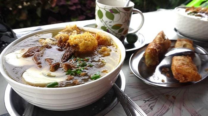 Traditional kinalas topped with eggs and fried garlic.