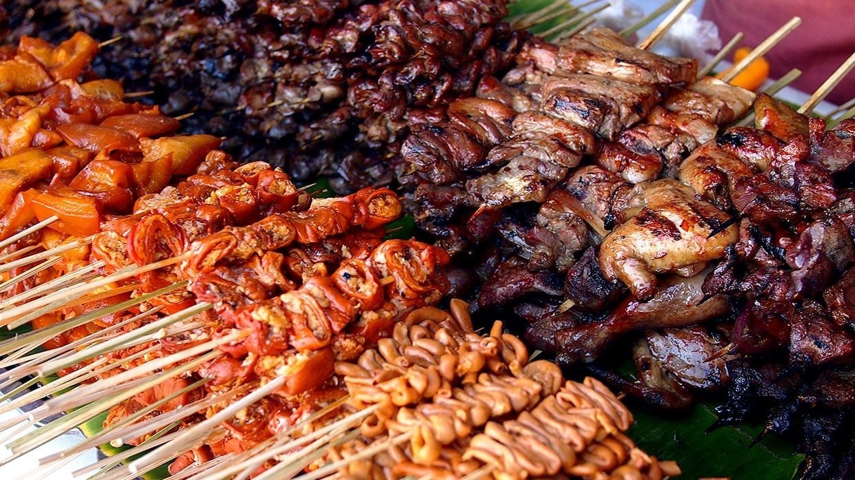 Assorted sinugba meats on sticks displayed before grilling. Assorted sinugba meats on sticks displayed before grilling.