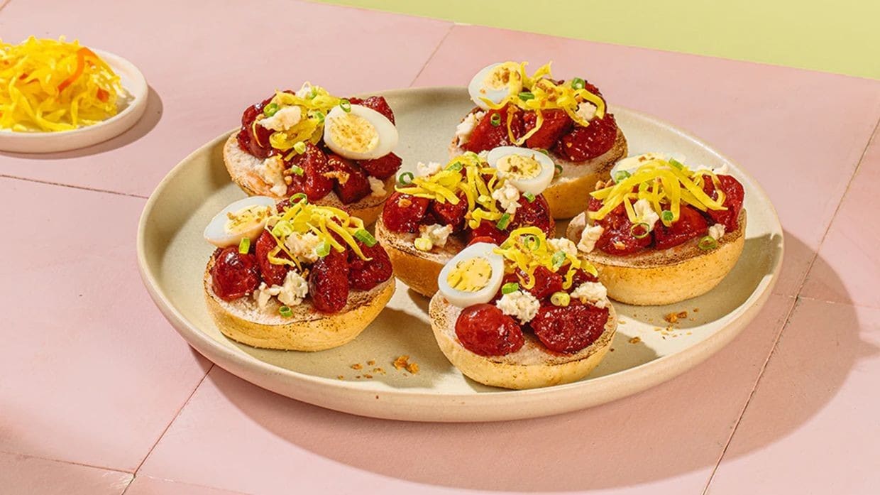 Chorizo Cebu canapés on pandesal topped with atchara and quail eggs. Chorizo Cebu canapés on pandesal topped with atchara and quail eggs.