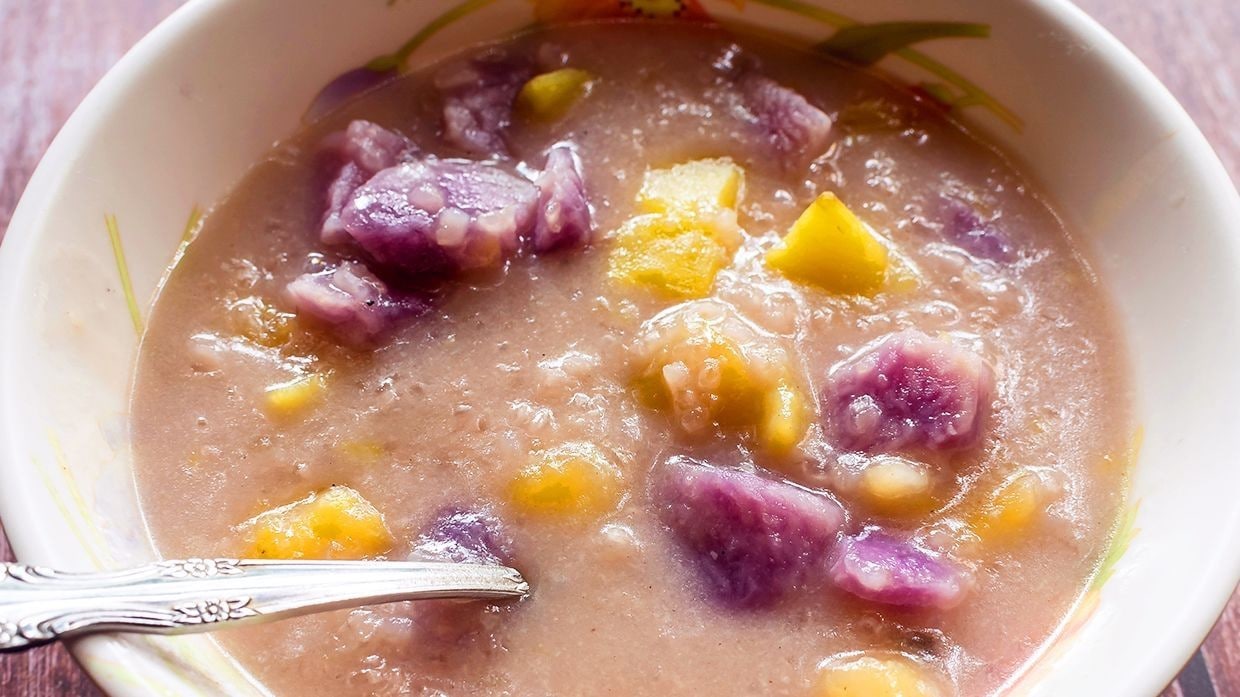 Binignit dessert in a bowl with sweet root crops and coconut milk. Binignit dessert in a bowl with sweet root crops and coconut milk.