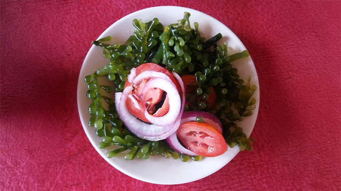 Fresh lato with red onions and tomatoes.