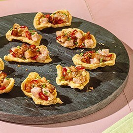Sinuglaw served on kropek bites as an appetizer. Sinuglaw served on kropek bites as an appetizer.