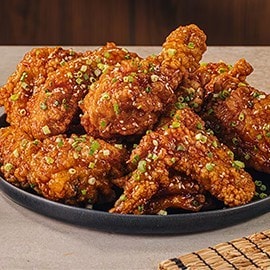 Korean fried chicken glazed in sweet chili sauce. Korean fried chicken glazed in sweet chili sauce.