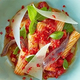 Pasta arrabbiata with anchovies and pecorino cheese. Pasta arrabbiata with anchovies and pecorino cheese.