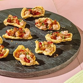Sinuglaw served on kropek bites as an appetizer. Sinuglaw served on kropek bites as an appetizer.