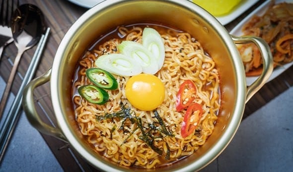Korean ramyeon served in a gold-plated aluminum pot. Korean ramyeon served in a gold-plated aluminum pot.