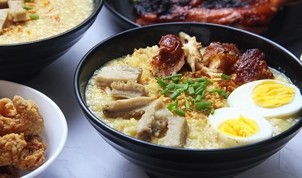 A big bowl of arroz caldo with various toppings. A big bowl of arroz caldo with various toppings.