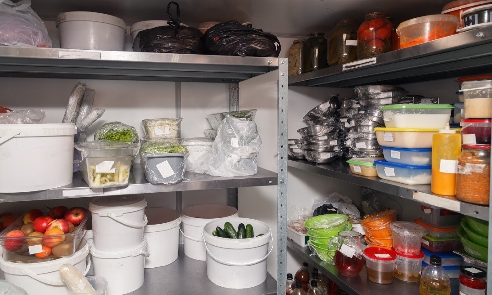 A restaurant kitchen pantry containing various ingredients and supplies A restaurant kitchen pantry containing various ingredients and supplies