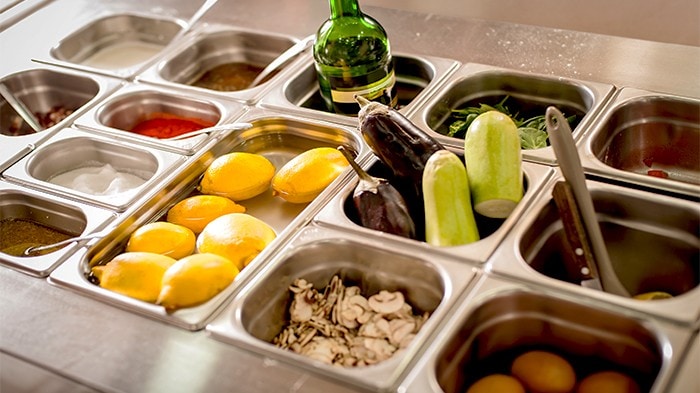 arious ingredients stored properly in stainless steel containers. 