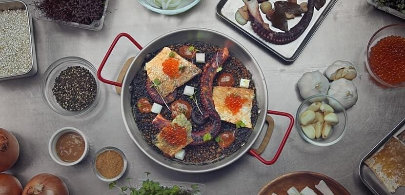 meal in a pan and ingredients in the table