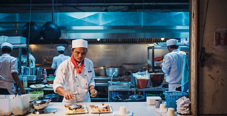 Chefs in Open Kitchen Cooking Chefs in Open Kitchen Cooking